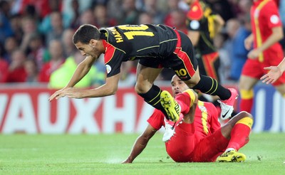 070912 - Wales v Belgium, FIFA 2014 World Cup Qualifying match - Wales' Ashley Williams tackles Belgium's Eden Hazard 