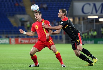 070912 - Wales v Belgium, FIFA 2014 World Cup Qualifying match - \Wales' Gareth Bale beats Belgium's Jan Vertonghen to the ball