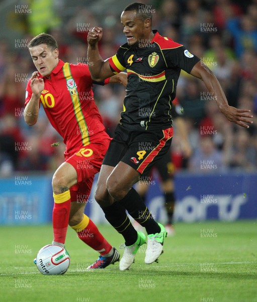 070912 - Wales v Belgium, FIFA 2014 World Cup Qualifying match - Wales' Aaron Ramsey challenges Belgium's Vincent Kompany 