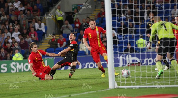 070912 - Wales v Belgium, FIFA 2014 World Cup Qualifying match - Wales' David Edwards challenges Belgium's Dries Mertens as he tries a shot at goal