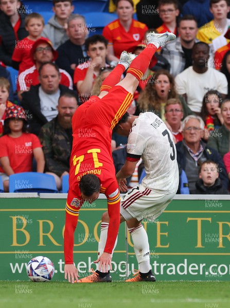 110622 - Wales v Belgium, UEFA Nations League -  Connor Roberts of Wales is upended by Arthur Theate of Belgium