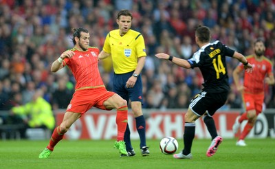 120615 - Wales v Belgium - UEFA European Championship 2016 Qualifier -Gareth Bale of Wales and Dries Mertens of Belgium compete