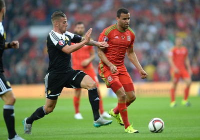 120615 - Wales v Belgium - UEFA European Championship 2016 Qualifier -Hal Robson-Kanu of Wales is challenged by Toby Alderweireld of Belgium