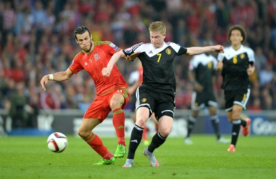 120615 - Wales v Belgium - UEFA European Championship 2016 Qualifier -Gareth Bale of Wales and Kevin De Bruyne of Belgium compete