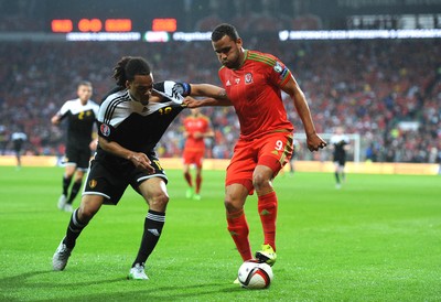120615 - Wales v Belgium - UEFA European Championship 2016 Qualifier -Hal Robson-Kanu of Wales is challenged by Jason Denayer of Belgium