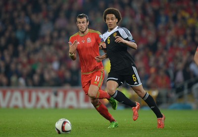 120615 - Wales v Belgium - UEFA European Championship 2016 Qualifier -Gareth Bale of Wales and Axel Witsel of Belgium compete