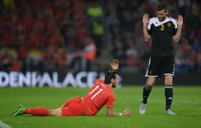 120615 - Wales v Belgium - UEFA European Championship 2016 Qualifier -Gareth Bale of Wales and Nicolas Lombaerts of Belgium collide