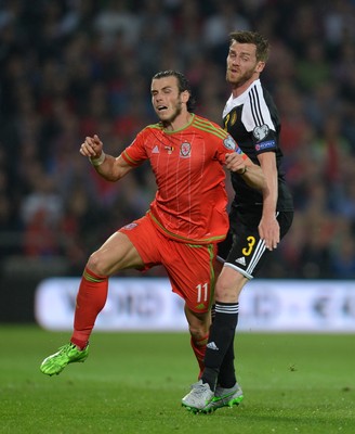 120615 - Wales v Belgium - UEFA European Championship 2016 Qualifier -Gareth Bale of Wales and Nicolas Lombaerts of Belgium collide