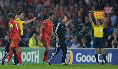 120615 - Wales v Belgium - UEFA European Championship 2016 Qualifier -Gareth Bale of Wales leaves the pitch with medical staff