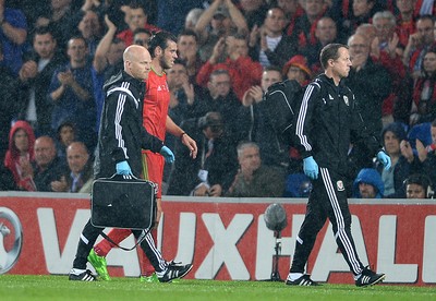 120615 - Wales v Belgium - UEFA European Championship 2016 Qualifier -Gareth Bale of Wales leaves the pitch with medical staff