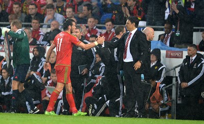 120615 - Wales v Belgium - UEFA European Championship 2016 Qualifier -Gareth Bale of Wales shakes hands with manager Chris Coleman