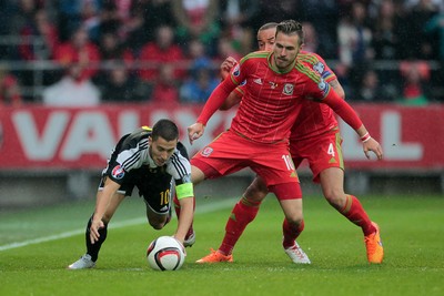 120615 - Wales v Belgium - UEFA European Qualifier - Aaron Ramsey of Wales tackles Eden Hazard of Belgium