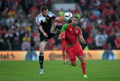 120615 - Wales v Belgium - UEFA European Qualifier - Hal Robson-Kanu of Wales challenges Nicolas Lombaerts of Belgium