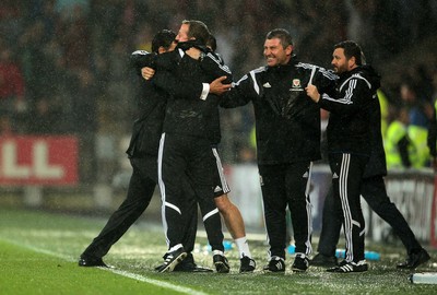 120615 - Wales v Belgium - UEFA European Qualifier - Wales manager Chris Coleman celebrates at full time with staff