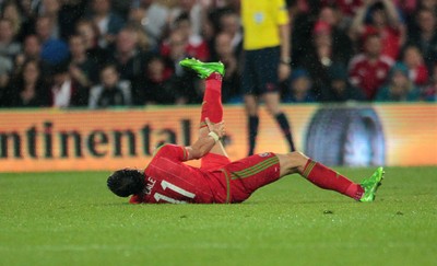 120615 - Wales v Belgium - UEFA European Qualifier - Gareth Bale of Wales goes down injured