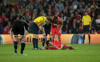 120615 - Wales v Belgium - UEFA European Qualifier - Gareth Bale of Wales goes down injured