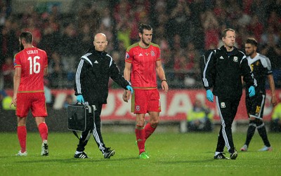 120615 - Wales v Belgium - UEFA European Qualifier - Gareth Bale of Wales goes off injured