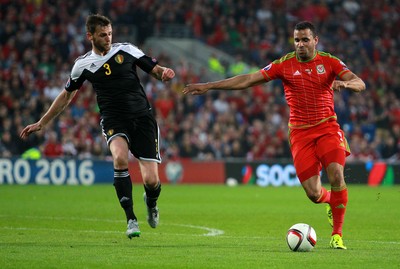 120615 - Wales v Belgium - UEFA European Qualifier - Hal Robson-Kanu of Wales is challenged by Nicolas Lombaerts of Belgium