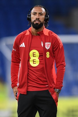 131025 - Wales v Belgium - 2026 FIFA World Cup Qualifying - Sorba Thomas of Wales arrives and inspects the pitch ahead of the match