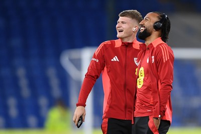 131025 - Wales v Belgium - 2026 FIFA World Cup Qualifying - Jordan James and sorta Thomas of Wales arrive and inspect the pitch ahead of the match
