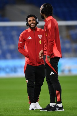 131025 - Wales v Belgium - 2026 FIFA World Cup Qualifying - Jay Dasilva of Wales arrives and inspects the pitch ahead of the match