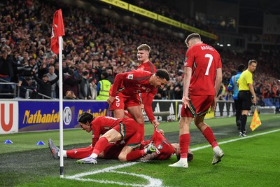 131025 - Wales v Belgium - 2026 FIFA World Cup Qualifying - Joe Rodon of Wales celebrates scoring a goal with team mates