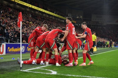 131025 - Wales v Belgium - 2026 FIFA World Cup Qualifying - Joe Rodon of Wales celebrates scoring a goal with team mates