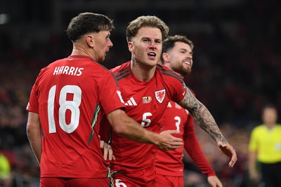 131025 - Wales v Belgium - 2026 FIFA World Cup Qualifying - Joe Rodon of Wales celebrates scoring a goal with team mates
