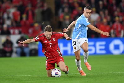 131025 - Wales v Belgium - 2026 FIFA World Cup Qualifying - David Brooks of Wales is challenged by Leandro Trossard of Belgium
