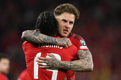 131025 - Wales v Belgium - 2026 FIFA World Cup Qualifying - Joe Rodon of Wales celebrates scoring a goal with team mates