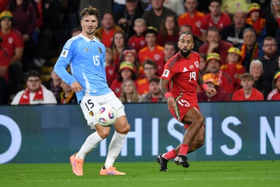 131025 - Wales v Belgium - 2026 FIFA World Cup Qualifying - Sorba Thomas of Wales puts a cross into the box