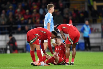 131025 - Wales v Belgium - 2026 FIFA World Cup Qualifying - Ben Davies of Wales leaves the field after appearing to pick up an injury