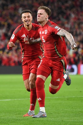 131025 - Wales v Belgium - 2026 FIFA World Cup Qualifying - Joe Rodon of Wales celebrates scoring a goal with Ethan Ampadu of Wales