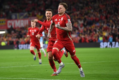 131025 - Wales v Belgium - 2026 FIFA World Cup Qualifying - Joe Rodon of Wales celebrates scoring a goal with Ethan Ampadu of Wales
