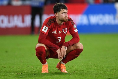131025 - Wales v Belgium - 2026 FIFA World Cup Qualifying - Dejected Neco Williams of Wales