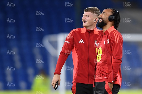 131025 - Wales v Belgium - 2026 FIFA World Cup Qualifying - Jordan James and sorta Thomas of Wales arrive and inspect the pitch ahead of the match