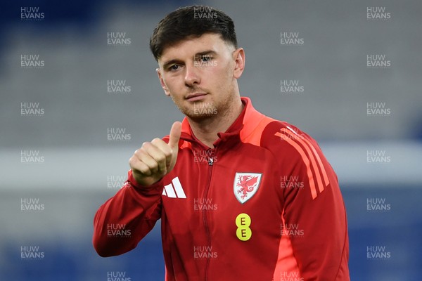 131025 - Wales v Belgium - 2026 FIFA World Cup Qualifying - Mark Harris of Wales arrives and inspects the pitch ahead of the match
