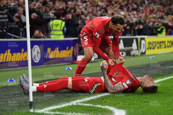 131025 - Wales v Belgium - 2026 FIFA World Cup Qualifying - Joe Rodon of Wales celebrates scoring a goal with team mates