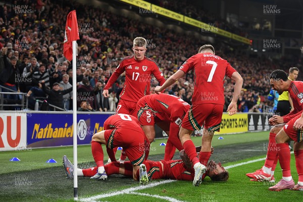 131025 - Wales v Belgium - 2026 FIFA World Cup Qualifying - Joe Rodon of Wales celebrates scoring a goal with team mates