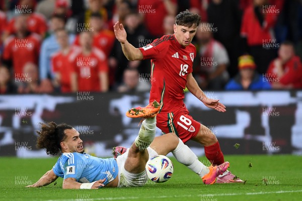 131025 - Wales v Belgium - 2026 FIFA World Cup Qualifying - Mark Harris of Wales is challenged by Arthur Theate of Belgium