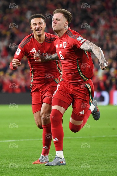 131025 - Wales v Belgium - 2026 FIFA World Cup Qualifying - Joe Rodon of Wales celebrates scoring a goal with Ethan Ampadu of Wales