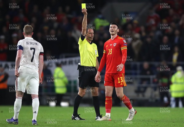 161121 - Wales v Belgium, 2022 World Cup Qualifier -  Kieffer Moore of Wales is shown a yellow card for foul on Axel Witsel of Belgium