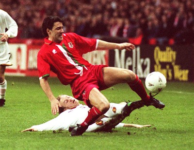 290397 - Wales v Belgium - FIFA World Cup Qualifier -  Dean Saunders is tackled by Albert De Roover