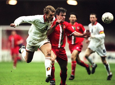 290397 - Wales v Belgium - FIFA World Cup Qualifier -  Mark Hughes challenges Albert De Roover