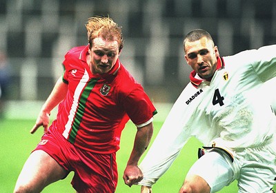 290397 - Wales v Belgium - FIFA World Cup Qualifier -  John Hartson of Wales is challenged by Eric Van Meir