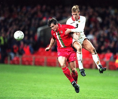 290397 - Wales v Belgium - FIFA World Cup Qualifier -  Makr Hughes is challenged by Albert de Roover