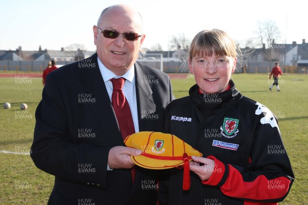 17.02.08.. Wales v Belgium, UEFA Women's Championship 2009.Jenner Park, Barry Peter Rees, President of the FAW, presents Kathryn Morgan with a special Welsh cap to mark her becoming the first Welsh women's player to reach 50 appearances.   