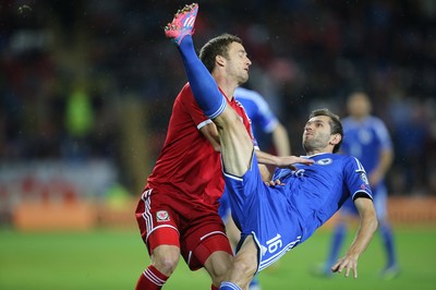 101014 - Wales v Bosnia-Herzegovina, UEFA European Championship 2016 - Wales' Andy King challenges Bosnia and Hertzegovina's Senad Lulic