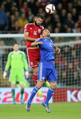 101014 - Wales v Bosnia-Herzegovina, UEFA European Championship 2016 - Wales' Joe Ledley and Bosnia and Hertzegovina's Vedad Ibisevic compete for the ball