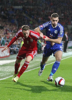 101014 - Wales v Bosnia-Herzegovina, UEFA European Championship 2016 - Wales' Chris Gunter and Bosnia and Hertzegovina's Tino-Sven Susic compete for the ball